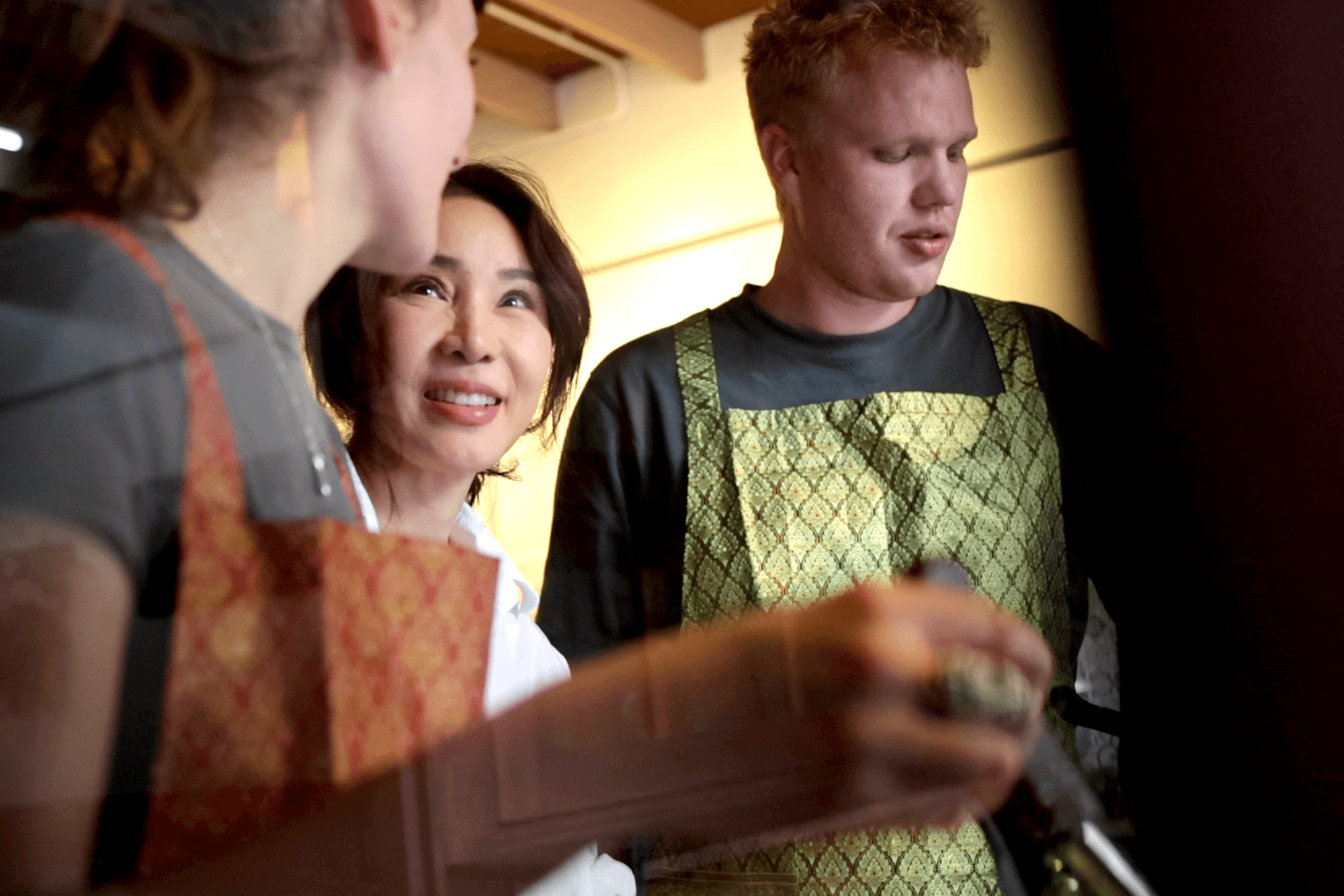 Students learning traditional recipes